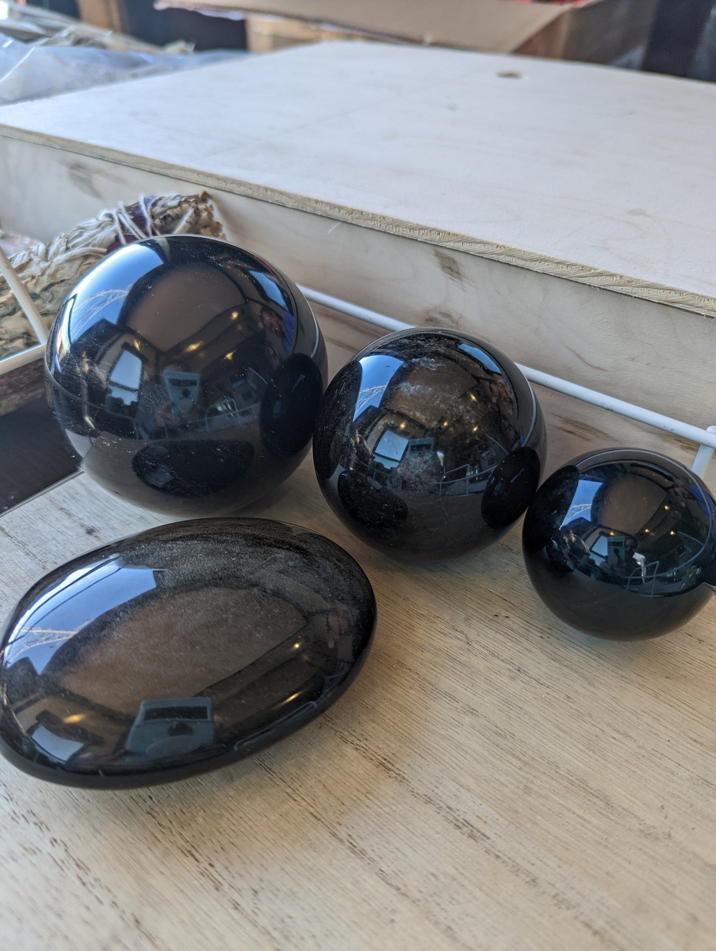 Gold sheen obsidian sphere