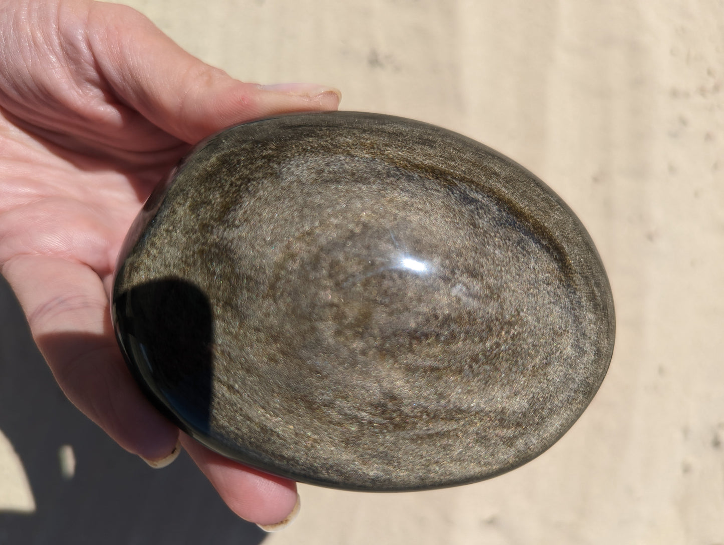 Gold sheen obsidian palm