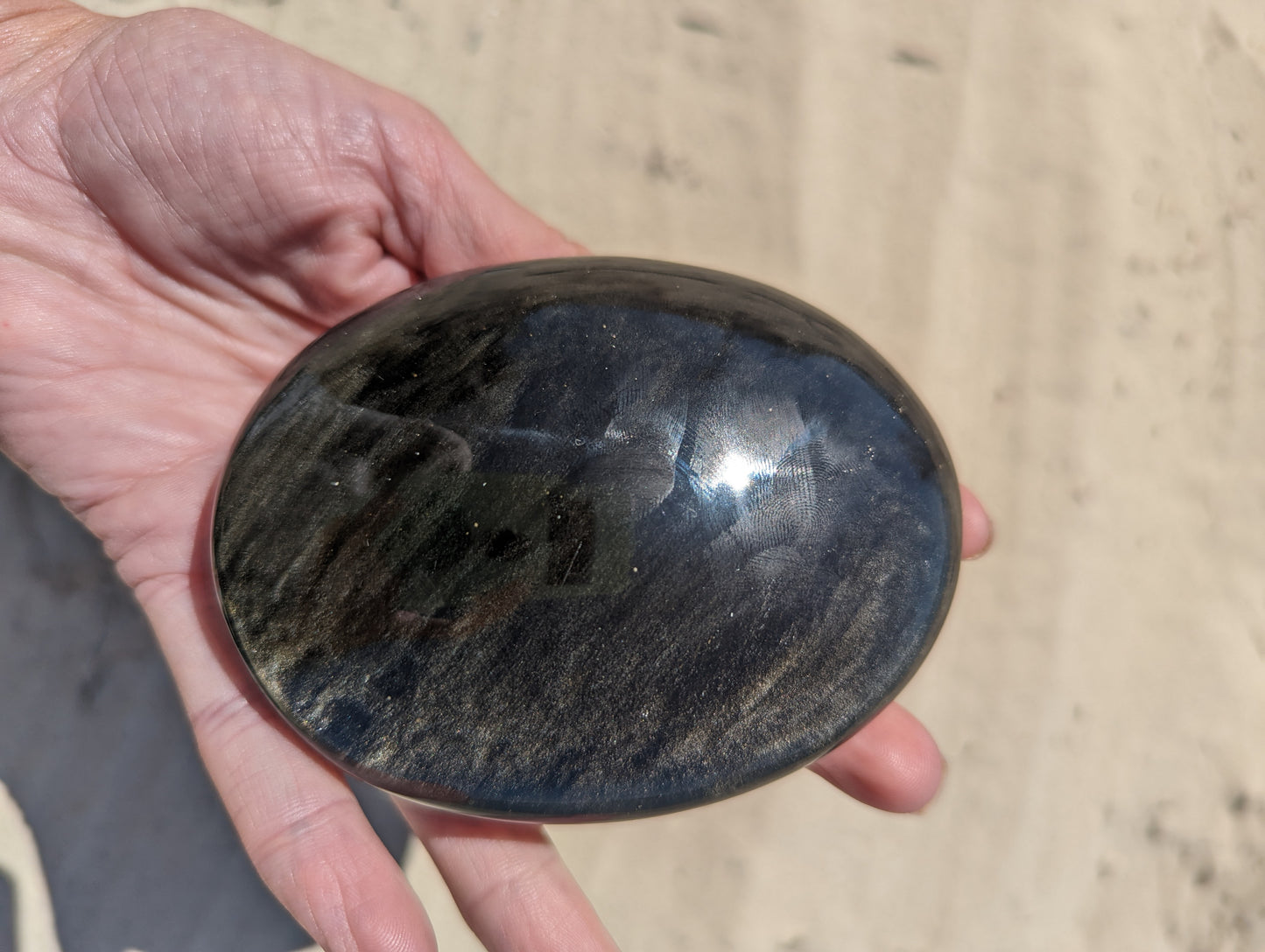 Gold sheen obsidian palm