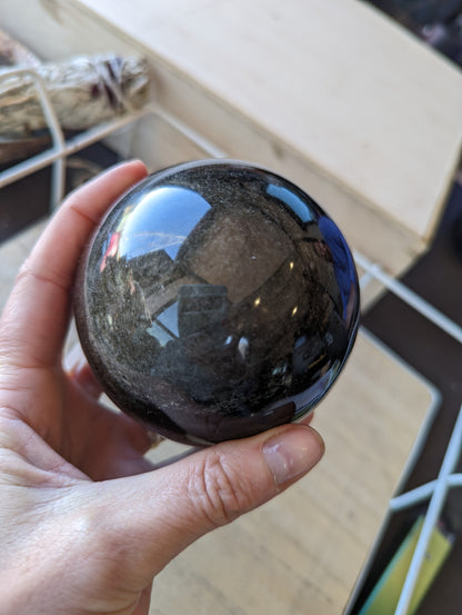 Gold sheen obsidian sphere